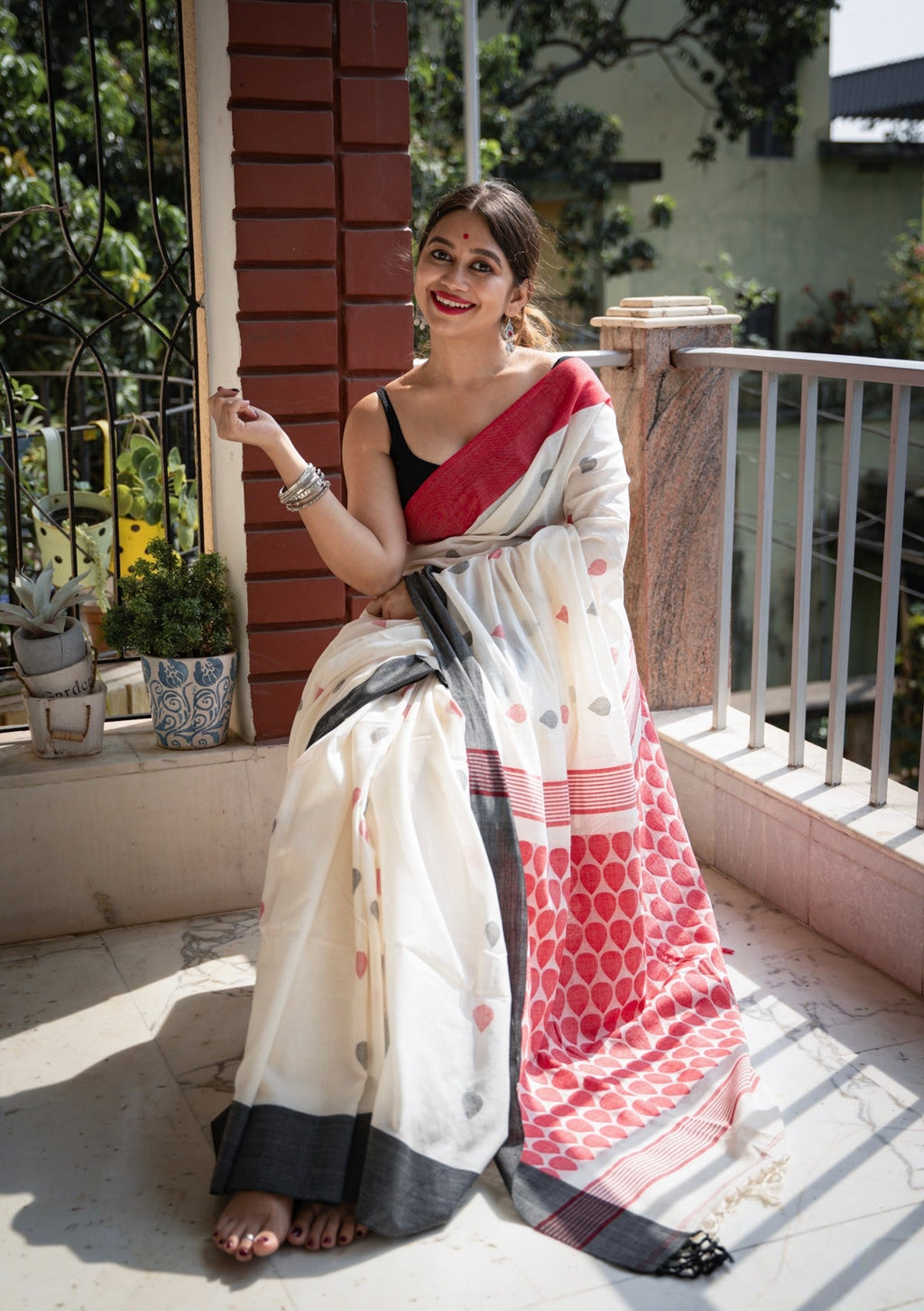 white and red linen printed saree